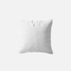White square fiber-filled cushion, slightly creased.