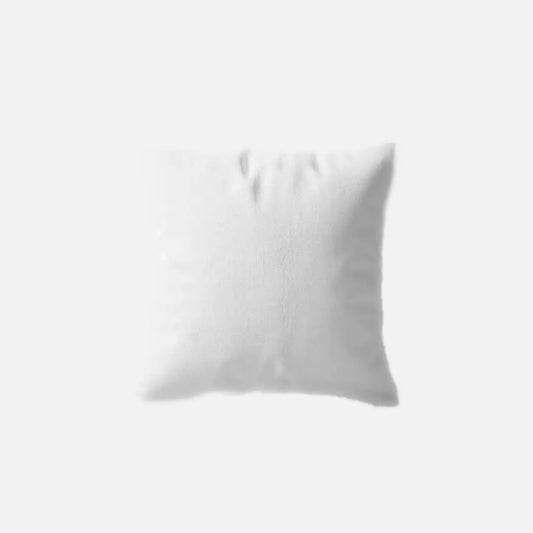 White square fiber-filled cushion, slightly creased.